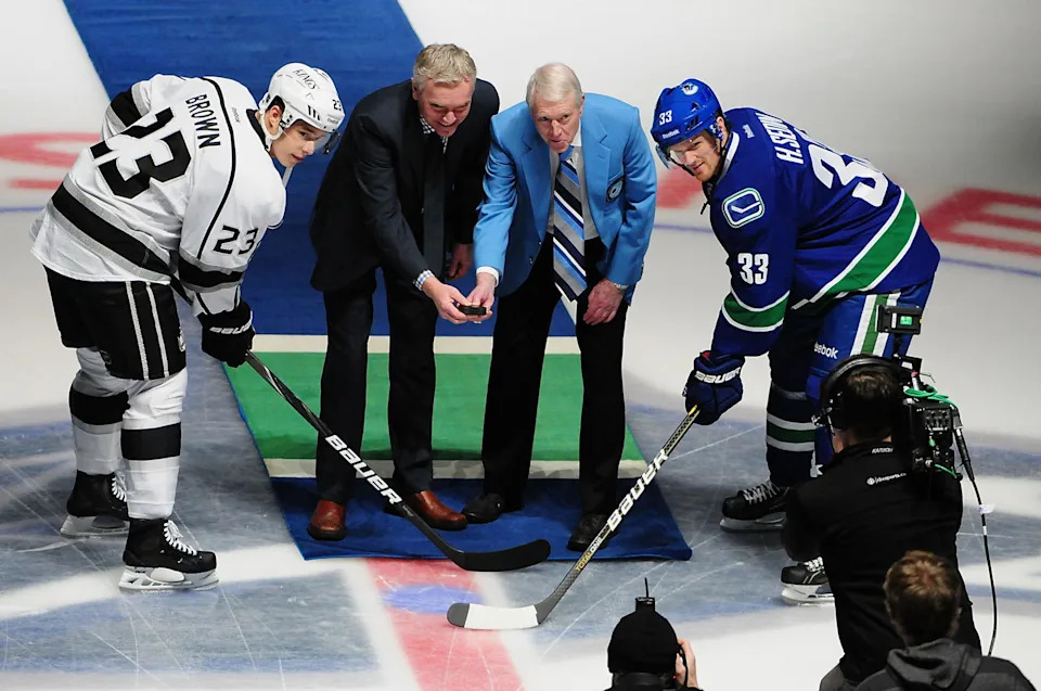 Mar 2, 2013; Vancouver, British Columbia, CAN; Sports broadcasters for CBC Jim Hughson and Jim Robson are honored during the first period as the Vancouver Canucks host the Los Angeles Kings at Rogers Arena. Mandatory Credit: Anne-Marie Sorvin-Imagn Images