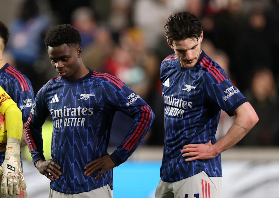 Arsenal's Bukayo Saka and Declan Rice look dejected after Brentford's Keane Lewis-Potter scores (Action Images via Reuters)