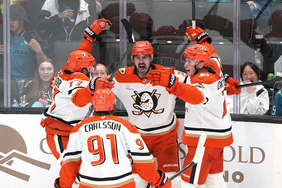 Oct 11, 2025; San Jose, California, USA; Anaheim Ducks left wing Chris Kreider (center) celebrates with left wing Alex Killorn (17) and center Leo Carlsson (91) and defenseman Jackson LaCombe (right) after scoring a goal against the San Jose Sharks during the third period at SAP Center at San Jose. Mandatory Credit: Darren Yamashita-Imagn Images