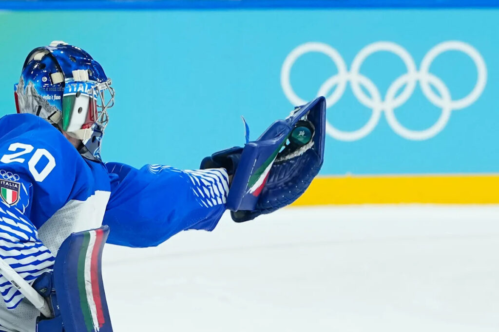 Lighter-colored boards replace dark ones in the hockey arenas at the Olympics Lighter-colored boards replace dark ones in the hockey arenas at the Olympics
