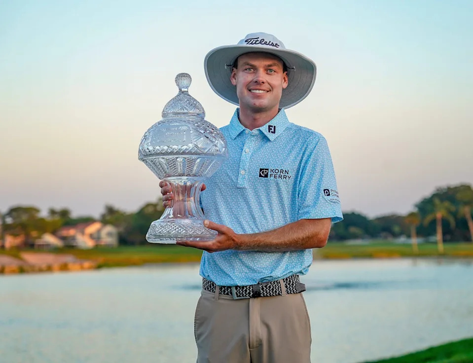 Joe Highsmith poses with the trophy after winning the Cognizant Classic in the Palm Beaches at PGA National Resort & Spa on Sunday, March 2, 2025, in Palm Beach Gardens, FL.