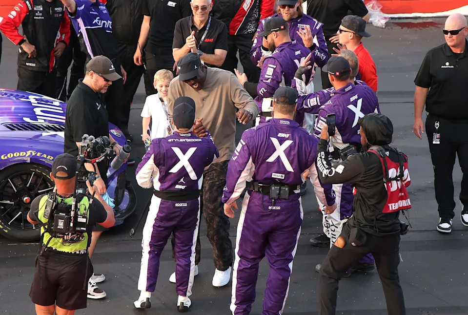 Michael Jordan congratulates Tyler Reddick, driver of the #45 Xfinity Toyota, after winning the NASCAR Cup Series Goodyear 400.