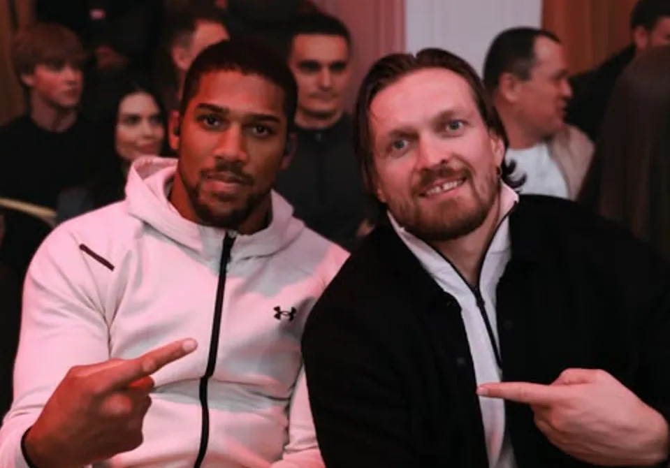 Joshua (left) and former opponent Oleksandr Usyk in Ukraine (@usykaa/Instagram)
