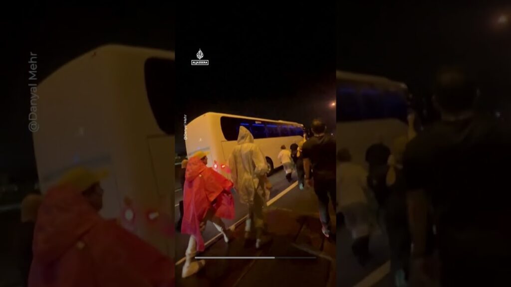 Crowd chants ‘save our girls’ at bus carrying Iran women’s team