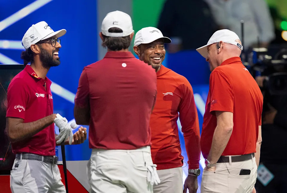 Akshay Bhatia, left, and Tiger Woods of Jupiter Links GC laugh against Boston Common Golf during TGL match at SoFi Center on March 17, 2026, in Palm Beach Gardens, Florida.