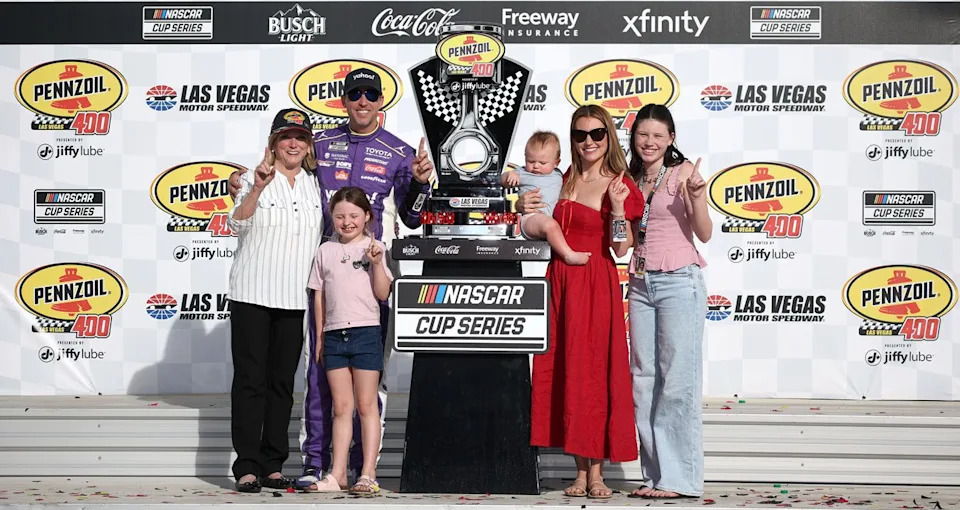 Denny Hamlin celebrates a NASCAR Cup Series win at Las Vegas in Victory Lane with his family.