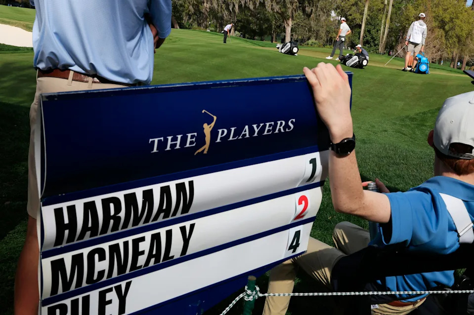 From left, Brian Harman putts as Maverick McNealy and Davis Riley look on, on the seventh green during the first round of The Players Championship PGA golf tournament at TPC Sawgrass, Thursday, March 12, 2026, in Ponte Vedra Beach, Fla. [Corey Perrine/Florida Times-Union]
