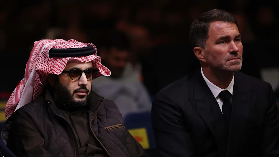 LONDON, ENGLAND - NOVEMBER 15: Turki Al-Sheikh, Chairman of the Saudi General Entertainment Authority, and Eddie Hearn, Chairman of Matchroom Sport, watch on during the WBO Global welterweight title fight between Jack Catterall and Ekow Essuman on the 'Unfinished Business' fight card at Tottenham Hotspur Stadium on November 15, 2025 in London, England. (Photo by Justin Setterfield/Getty Images)