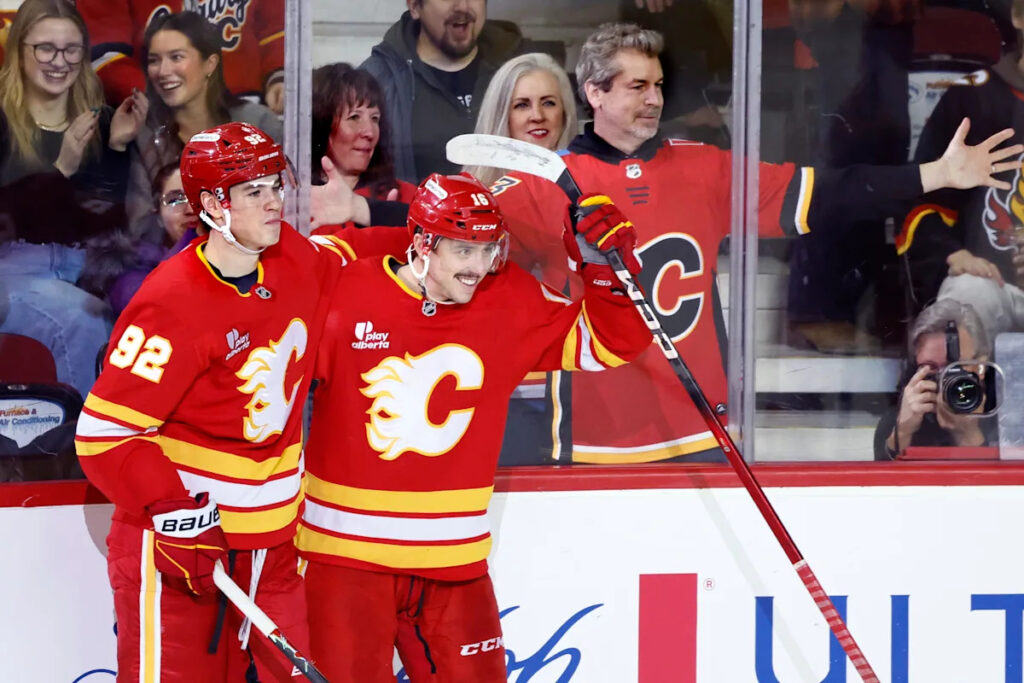Flames ignite their offense, burn Canucks 7-3 Flames ignite their offense, burn Canucks 7-3