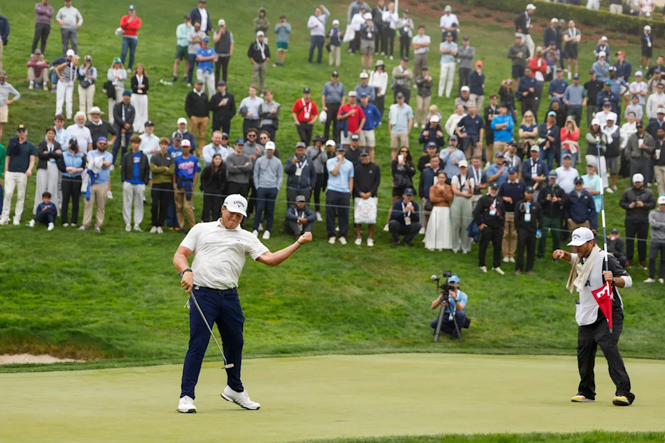 Jackson Herrington celebrates with his caddie after sinking his putt to win the match during the semifinals of the 2025 U.S. Amateur at The Olympic Club (Lake Course) in San Francisco, Calif. on Saturday, Aug. 16, 2025.