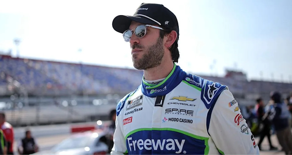 Daniel Suárez looks on.