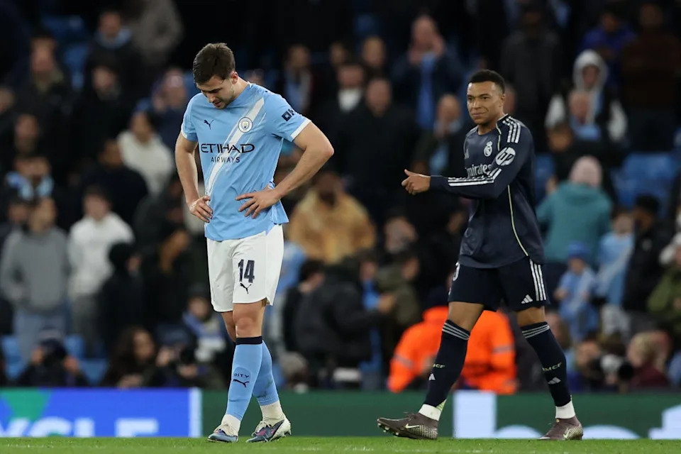 City's Nico Gonzalez looks dejected after the match as Real Madrid's Kylian Mbappe looks on (Reuters)