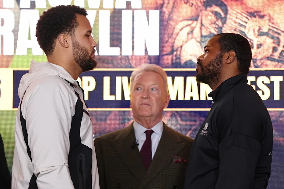 Itauma facing off with Jermaine Franklin, as Frank Warren watches on (Getty)