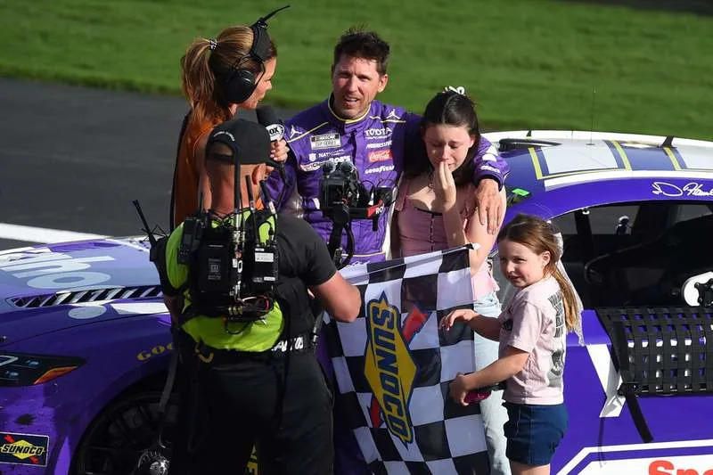 LAS VEGAS, NV – MARCH 15: Denny Hamlin 11 Joe Gibbs Racing Yahoo Toyota celebrates winning the race with his daughters Taylor and Molly during the NASCAR, Motorsport, USA Cup Series Pennzoil 400 on March 15, 2026, at Las Vegas Motor Speedway in Las Vegas, NV. Photo by Chris Williams/LVMS/Icon Sportswire AUTO: MAR 15 NASCAR Cup Series Pennzoil 400 EDITORIAL USE ONLY Icon0072603150172