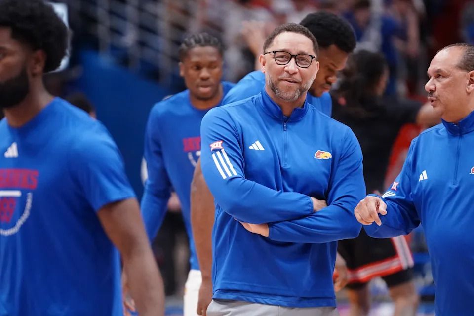 Kansas Jayhawks assistant coach Tony Bland watches players warm up before taking on Houston Cougars for the game inside Allen Fieldhouse on Monday, Feb. 23, 2026.