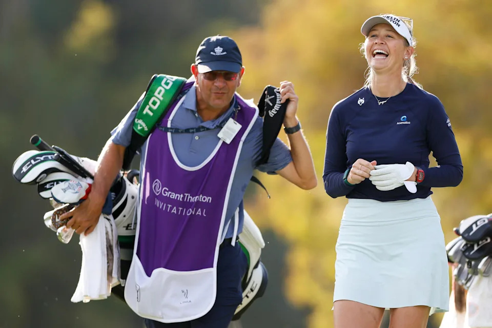 Jessica Korda laughs as she walks the third hole with her caddie during the final round of the 2025 Grant Thornton Invitational at Tiburon Golf Club.