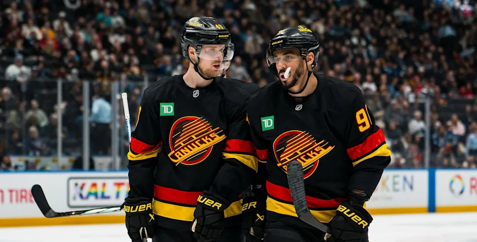 Elias Pettersson and Evander Kane (Bob Frid-Imagn Images)