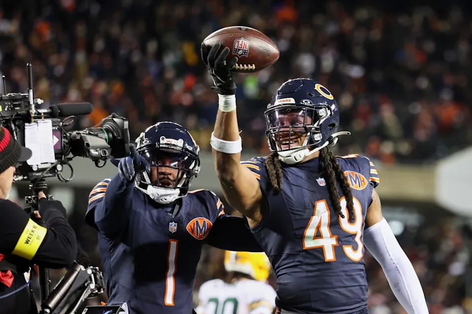 Bears linebacker Tremaine Edmunds poses for a television camera with cornerback Jaylon Johnson (1) after recovering a fumble against the Packers. Mike Dinovo-Imagn Images