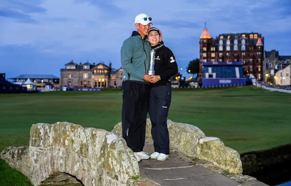 Lydia Ko of New Zealand and her husband Jun Chung with the AIG Women's Open Championship trophy on the Swilcan Bridge during day four of the 2024 AIG Women's Open Championship at The Old Course, on August 25, 2024, in St. Andrews, Scotland.