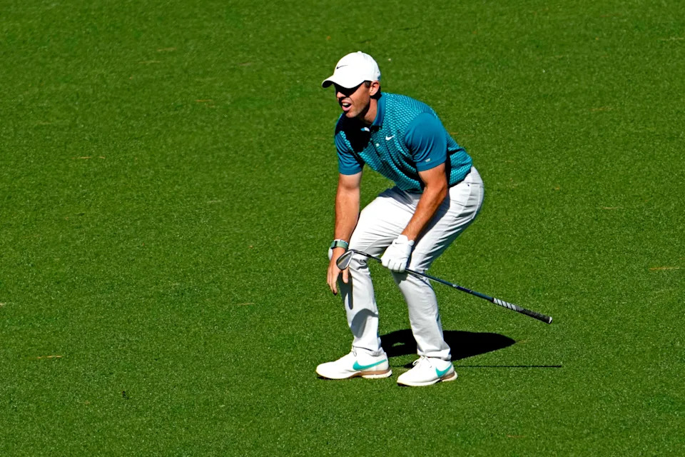 Rory McIlroy reacts to his second shot on the 15th hole during the final round of the 2025 Masters. He curved a 7-iron from 207 yards around pine trees to set up a critical birdie en route to victory.