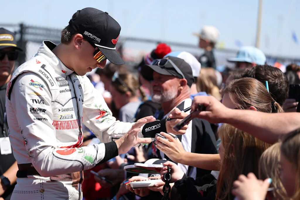 Carson Hocevar celebrates NASCAR Talladega win by driving car while hanging out of window