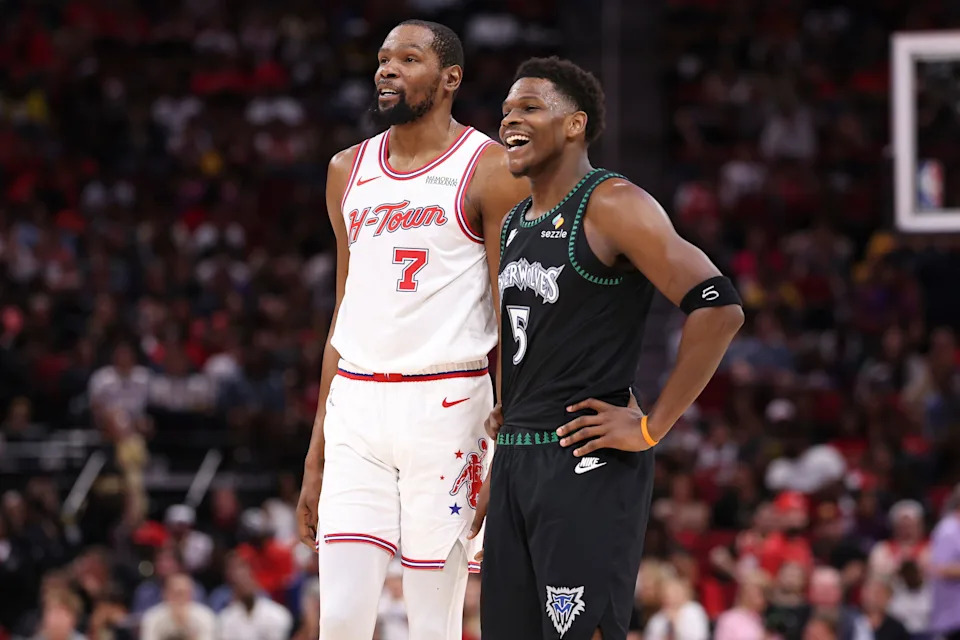 Houston Rockets forward Kevin Durant (7) talks with Minnesota Timberwolves guard Anthony Edwards (5) during their game on April 10, 2026.