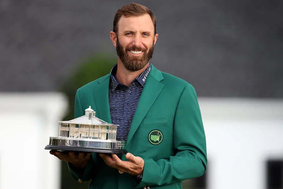 AUGUSTA, GEORGIA - NOVEMBER 15:  Dustin Johnson of the United States poses with the Masters Trophy during the Green Jacket Ceremony after winning the Masters during the final round of the Masters at Augusta National Golf Club on November 15, 2020 in Augusta, Georgia. (Photo by Rob Carr/Getty Images)