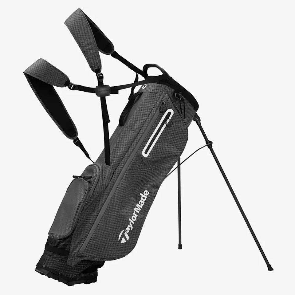 A gray TaylorMade golf stand bag with dual shoulder straps, zippered pockets, and extended legs to keep the bag upright—an ideal choice for anyone seeking one of the best golf bags 2026 has to offer.