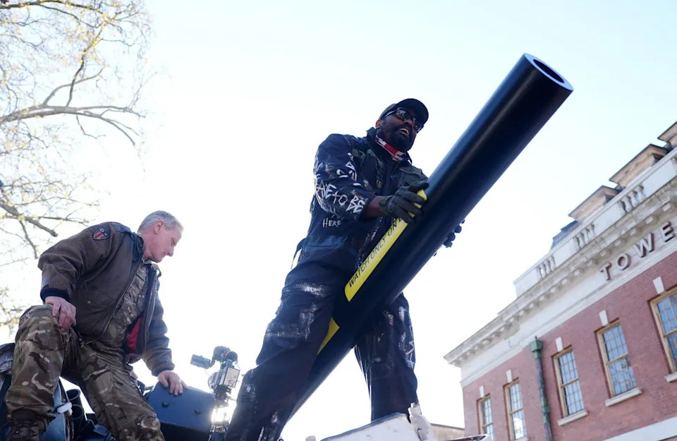 Chisora straddles the tank's cannon before heading for York Hall (Adam Davy/PA Wire)