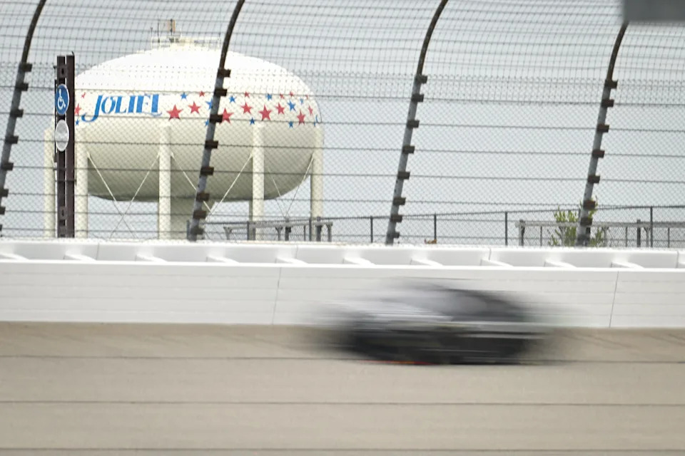 Denny Hamlin drivers through Turn 4 with the Joliet water tower seen in the distance during a Goodyear tire test Wednesday, April 22, 2026, at Chicagoland Speedway in Joliet, Illinois.