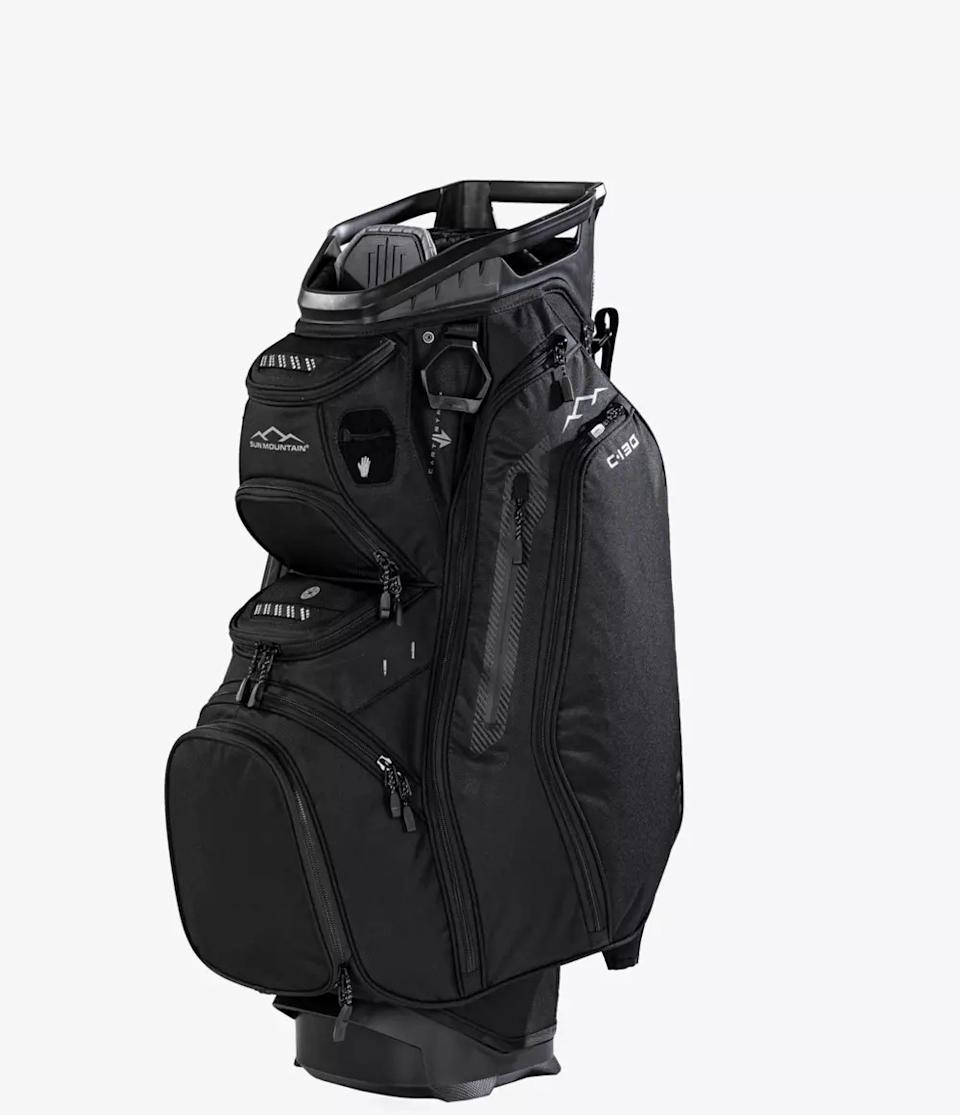 A black golf bag with multiple zippered compartments, a sturdy top handle, and organized club dividers—an ideal choice for anyone seeking the best golf bags 2026—shown standing upright against a plain white background.