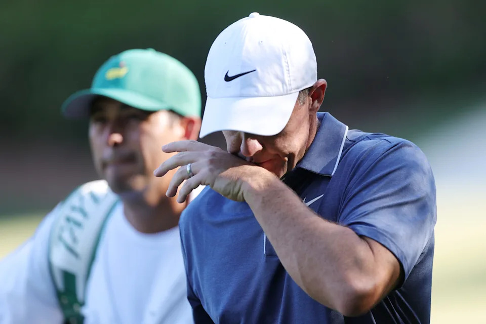 AUGUSTA, GEORGIA - APRIL 13: Rory McIlroy of Northern Ireland reacts as he walks with caddie Harry Diamond after the 13th hole during the final round of the 2025 Masters Tournament at Augusta National Golf Club on April 13, 2025 in Augusta, Georgia. (Photo by Andrew Redington/Getty Images)
