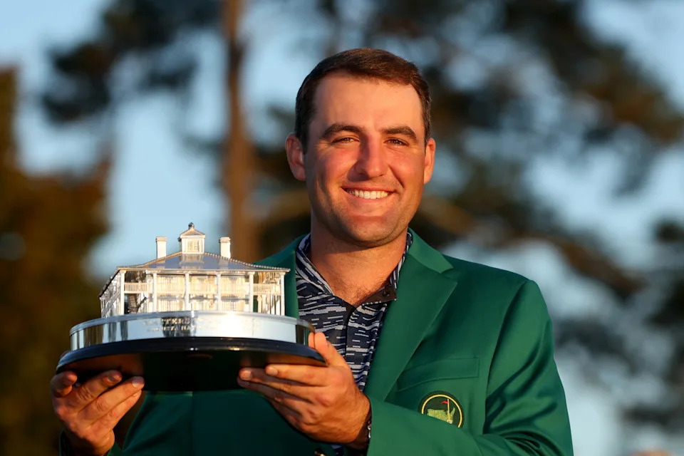 AUGUSTA, GEORGIA - APRIL 10: Scottie Scheffler poses with the Masters trophy during the Green Jacket Ceremony after winning the Masters at Augusta National Golf Club on April 10, 2022 in Augusta, Georgia. (Photo by Andrew Redington/Getty Images)