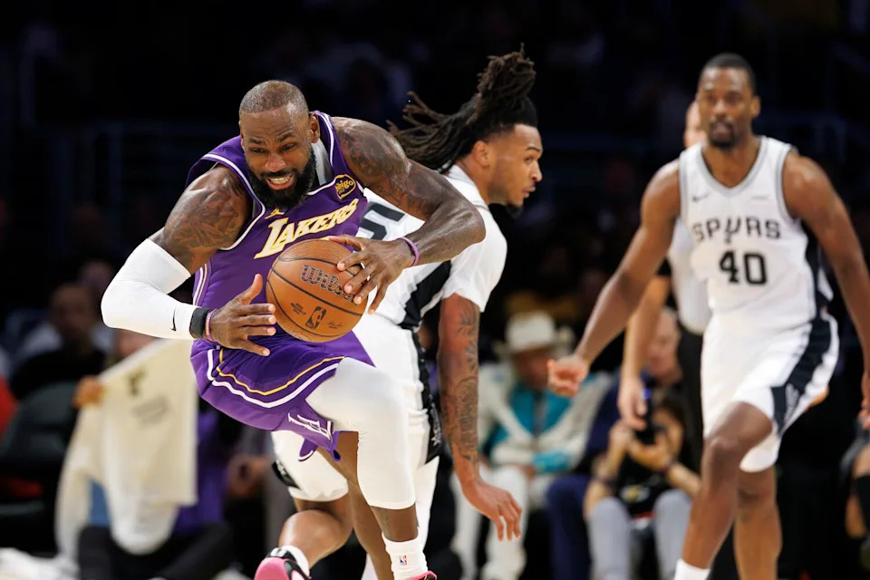 Lakers forward LeBron James starts a fast break against the Spurs.