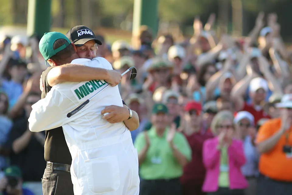 AUGUSTA, GA - APRIL 11:  Phil Mickelson hugs his caddie Jim Mackay after his three-stroke victory after winning the 2010 Masters Tournament at Augusta National Golf Club on April 11, 2010 in Augusta, Georgia.  (Photo by Jamie Squire/Getty Images)