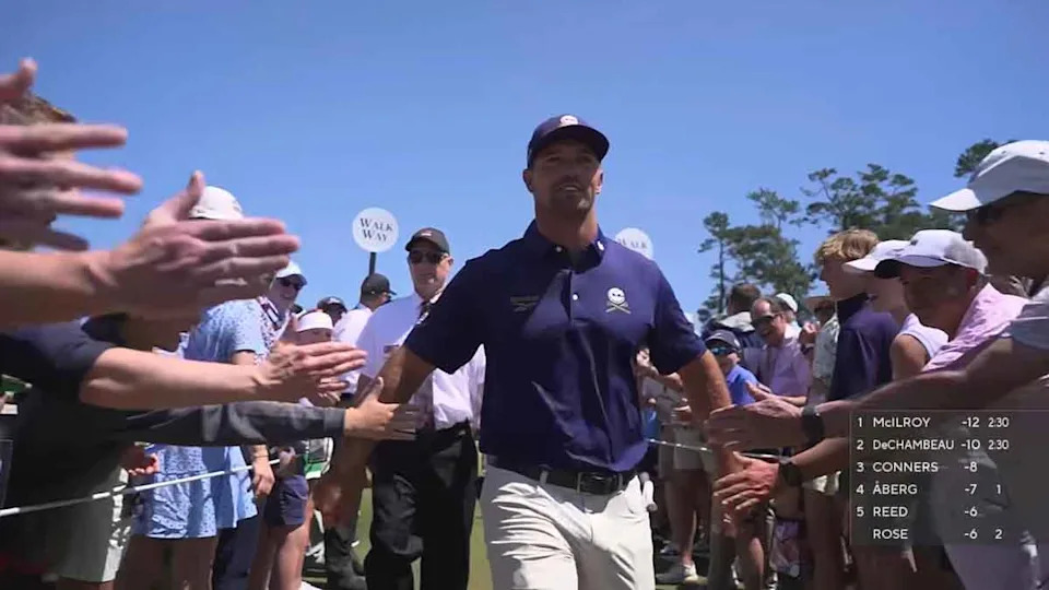 Bryson DeChambeau embraces fans at the Masters