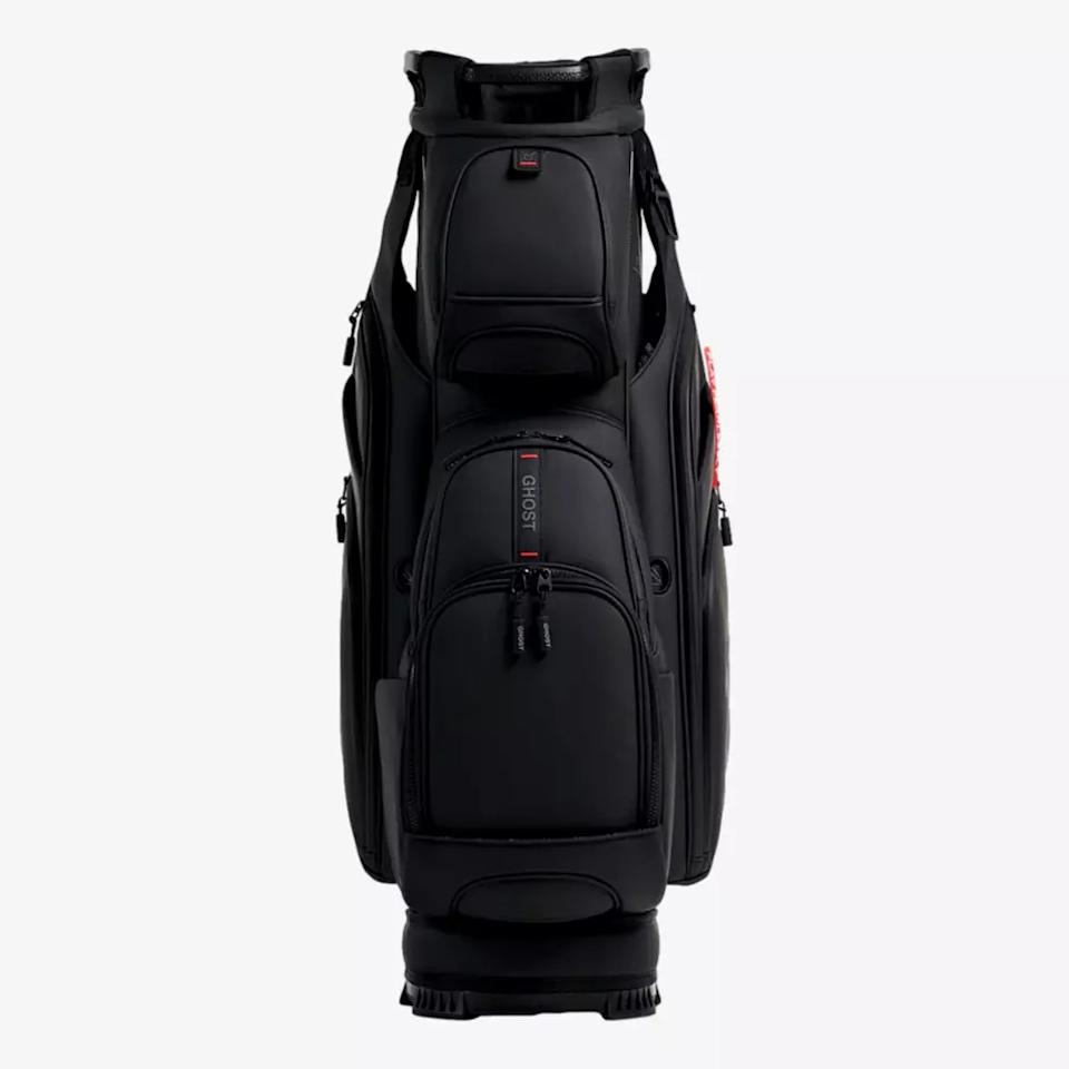 A black golf bag with multiple zippered compartments, shown standing upright against a plain white background. The sleek, modern design and subtle logo make it a standout choice among the best golf bags 2026 has to offer.