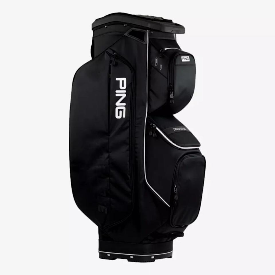 A black PING golf bag with multiple zippered pockets and compartments, standing upright against a plain white background. The PING logo is prominently displayed in white on the side—an ideal contender for the best golf bags 2026.