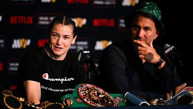 Katie Taylor flanked by Eddie Hearn following her win over Amanda Serrano in New York last summer