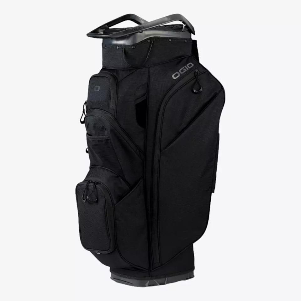 A black OGIO golf bag, featuring multiple zippered pockets and a sturdy top handle, showcases its sleek modern design—an excellent choice for anyone searching for the best golf bags 2026.