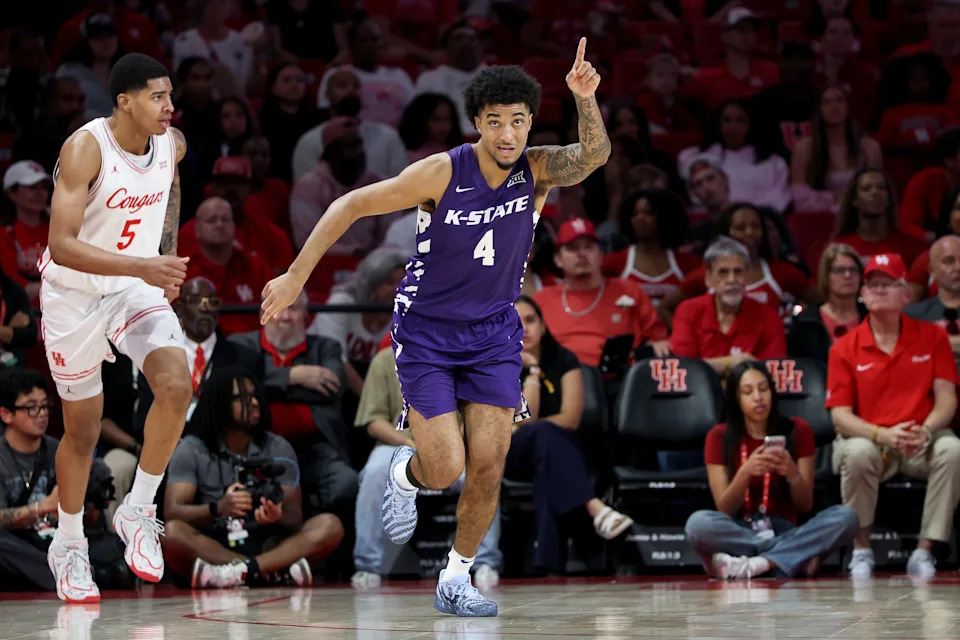 PJ Haggerty #4 of the Kansas State Wildcats reacts after a three-point basket in the first half against the Houston Cougars at Fertitta Center on February 14, 2026 in Houston, Texas.