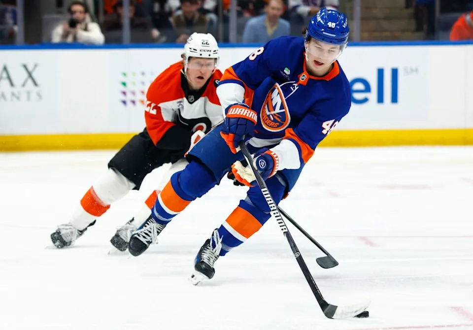 Matthew Schaefer (48) controls the puck against Philadelphia Flyers center Christian Dvorak (22) during the second period of an NHL hockey game, Friday, April 3, 2026 in Elmont, N.Y. Noah K. Murray for NY Post