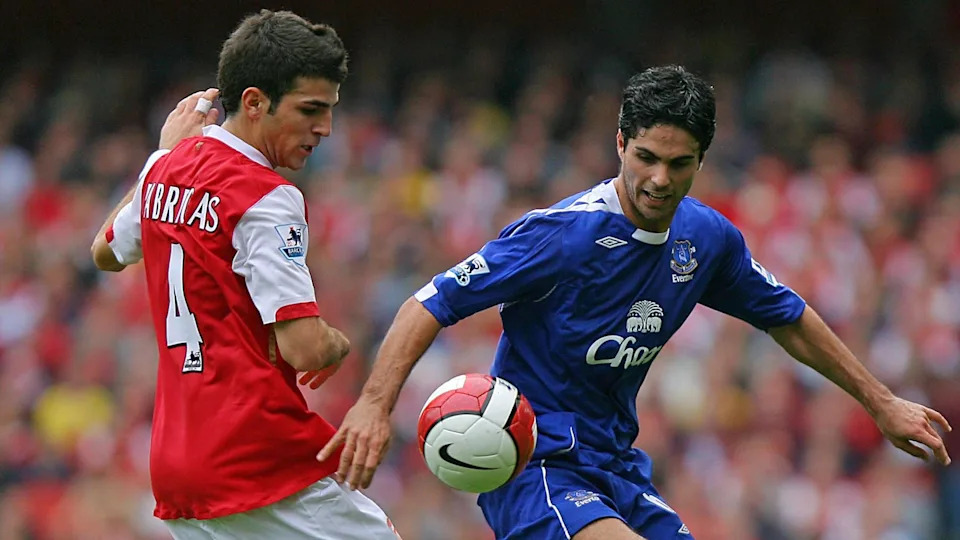 Cesc Fabregas of Arsenal and Mikel Arteta playing for Everton compete for the ball. 