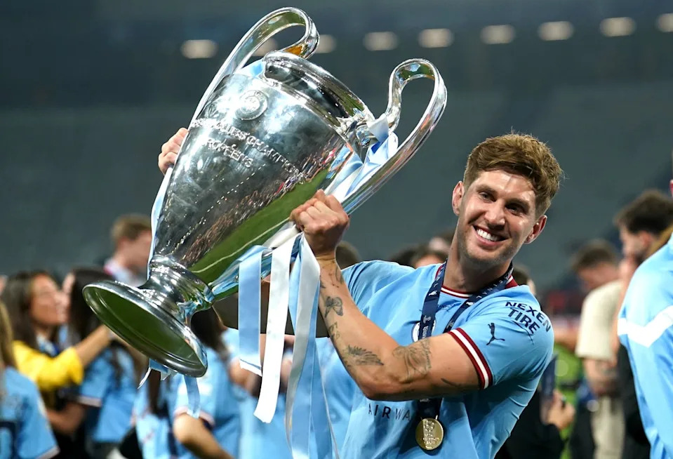 John Stones holds the Champions League trophy (PA Archive)