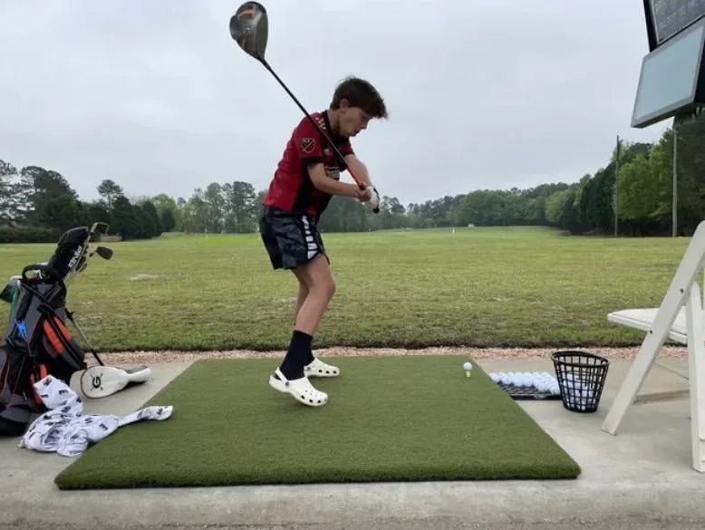 Nicholas Moorhead of Alpharetta swings his driver at the Practice Club at Jones Creek in this photo from 2023.
