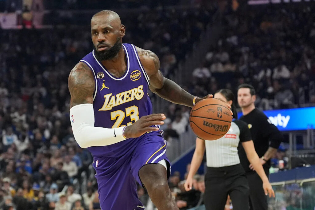 LeBron James has 26 points, 11 assists to lead Lakers past Warriors 119-103 as Stephen Curry sits