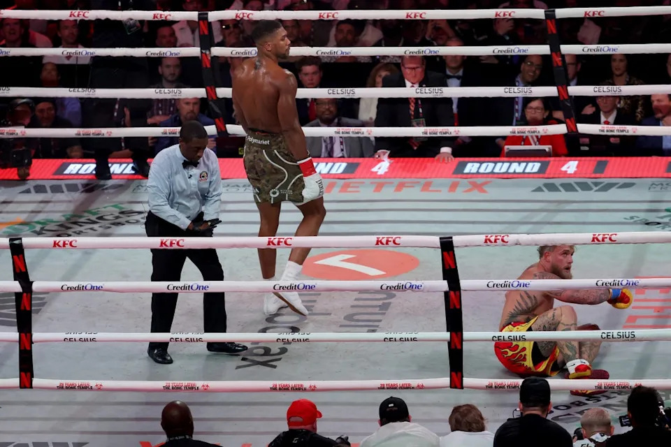 Joshua was able to pin down an elusive Jake Paul in the sixth round and secure a TKO (Getty)