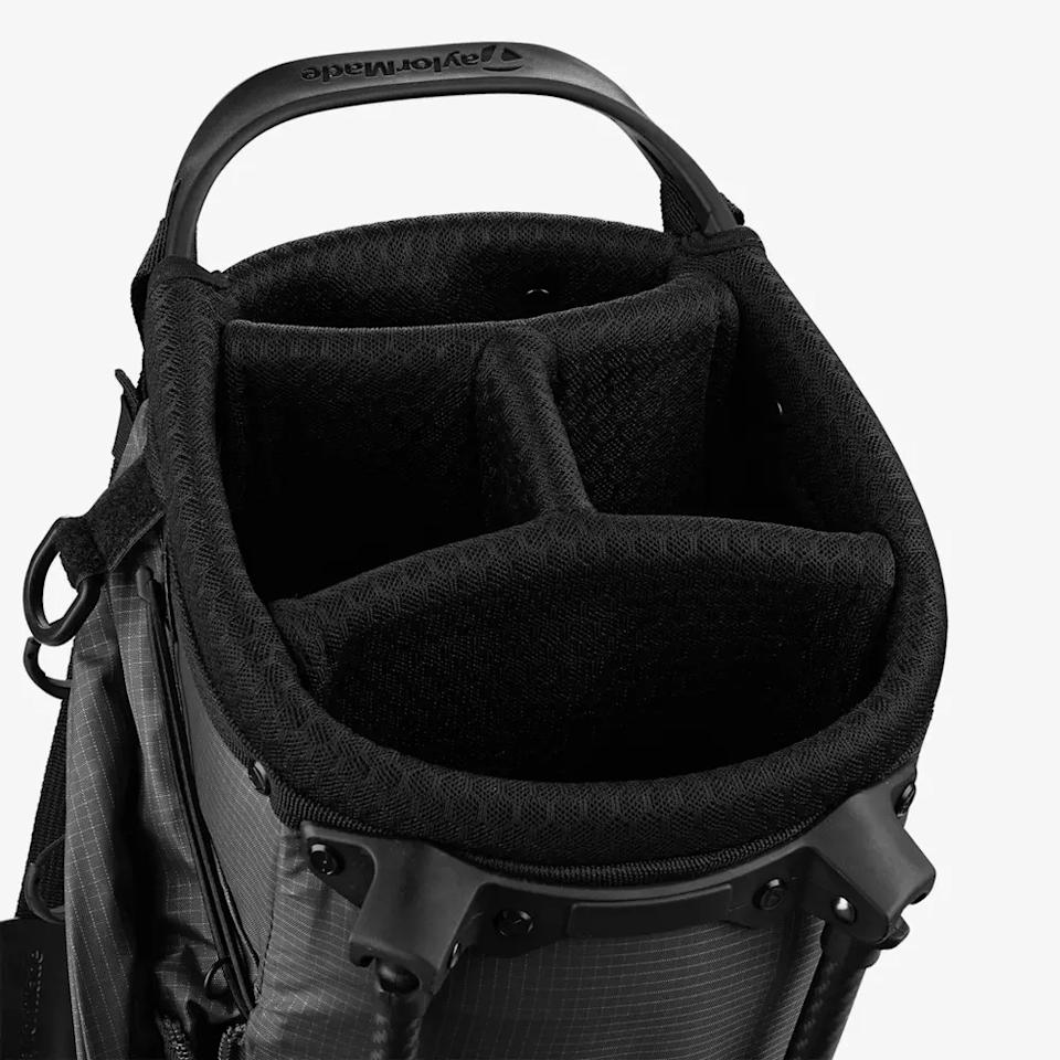 Top view of a black golf bag with multiple padded dividers for organizing golf clubs, featuring a sturdy handle and a textured outer material—ideal for those seeking the best golf bags 2026.