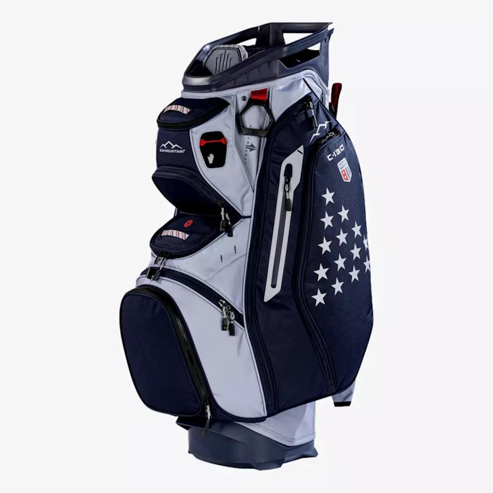 A navy blue and gray golf bag with multiple zippered pockets, a padded handle, and a star pattern on its side—this upright bag offers smart compartments and detailing, making it one of the best golf bags 2026 has to offer.