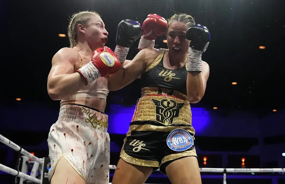 Lauren Price (left) goes on the attack against Stephanie Pineiro (Nick Potts/PA)